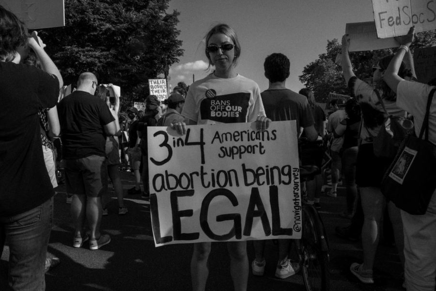 Photo by Harrison Mitchell courtesy of Unsplash. Protestors gather outside the Supreme Court to oppose the overturn of Roe v. Wade. 