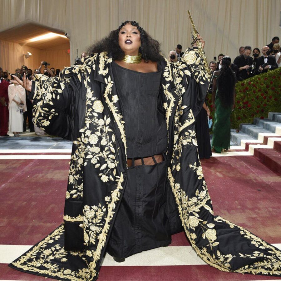 Lizzo included a gothic Gilded Age style dress, her corset reaching the floor accompanied by a large, flowing robe that would’ve been worn over tea gowns.