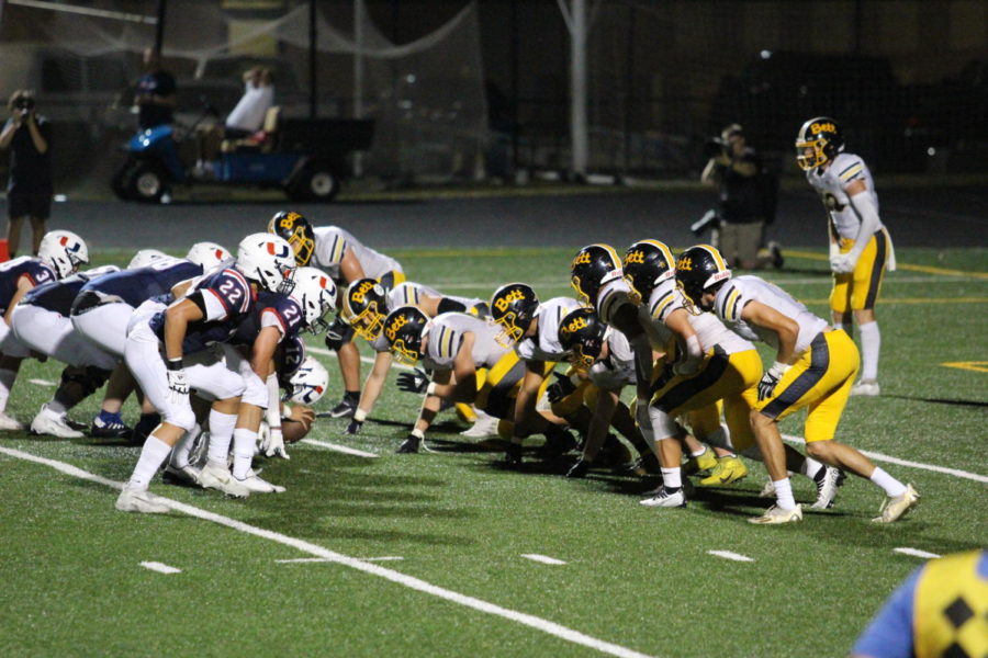 The+Bulldog+defensive+line+bears+down+in+an+attempt+to+keep+Urbandale+out+of+the+endzone.+