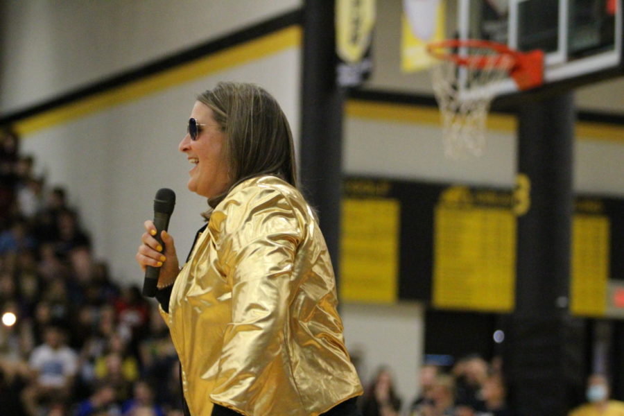 Star performer: Kristy Cleppe shows off her vocal skills while performing with the Goldusters at last Fridays pep aud. For Cleppe, in her first year as head principal,  she hopes to bring back a culture of fun and positivity for both students and staff. 