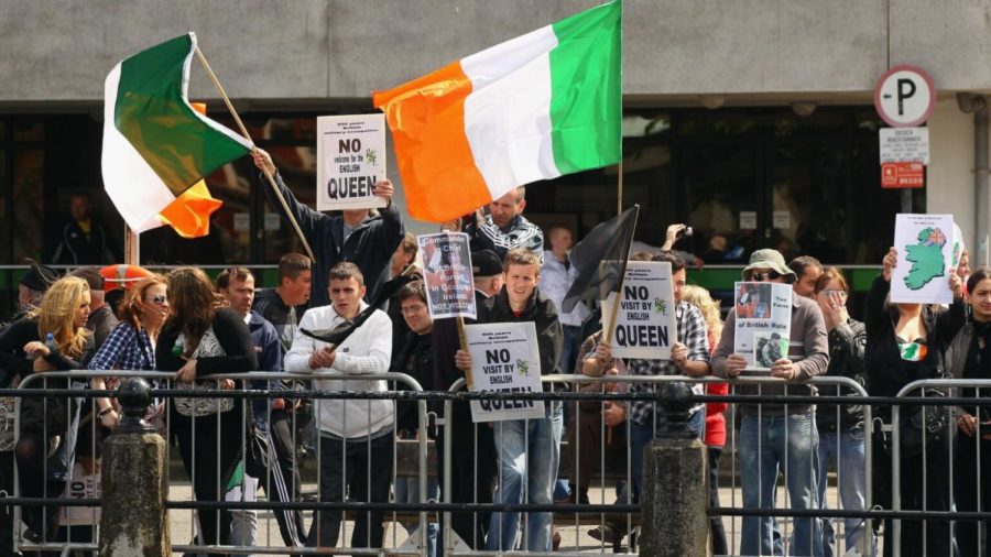 CORK%2C+IRELAND+-+MAY+20%3A++Protesters+demonstrate+against+the+state+visit+by+Queen+Elizabeth+II+as+she+traveled+to+English+Market+on+May+20%2C+2011+in+Cork%2C+Ireland.+The+Duke+and+Queens+visit+to+Ireland+was+the+first+by+a+monarch+since+1911.++%28Photo+by+Oli+Scarff%2FGetty+Images%29